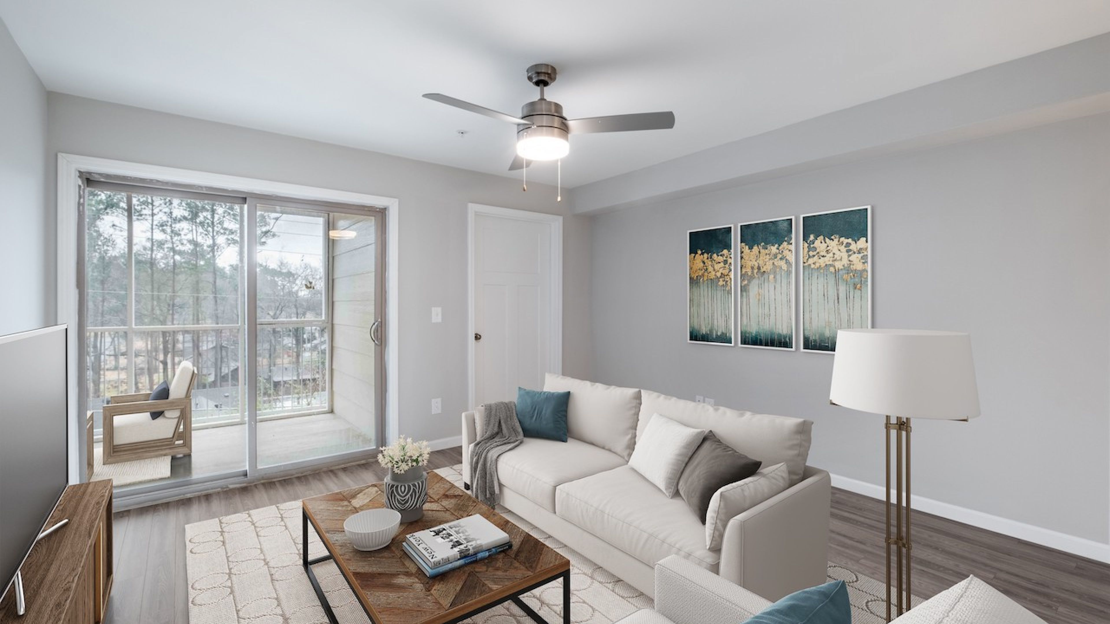 Hawthorne at Wisteria apartment living room with large patio doors, furnished with a couch, coffee table, and chair