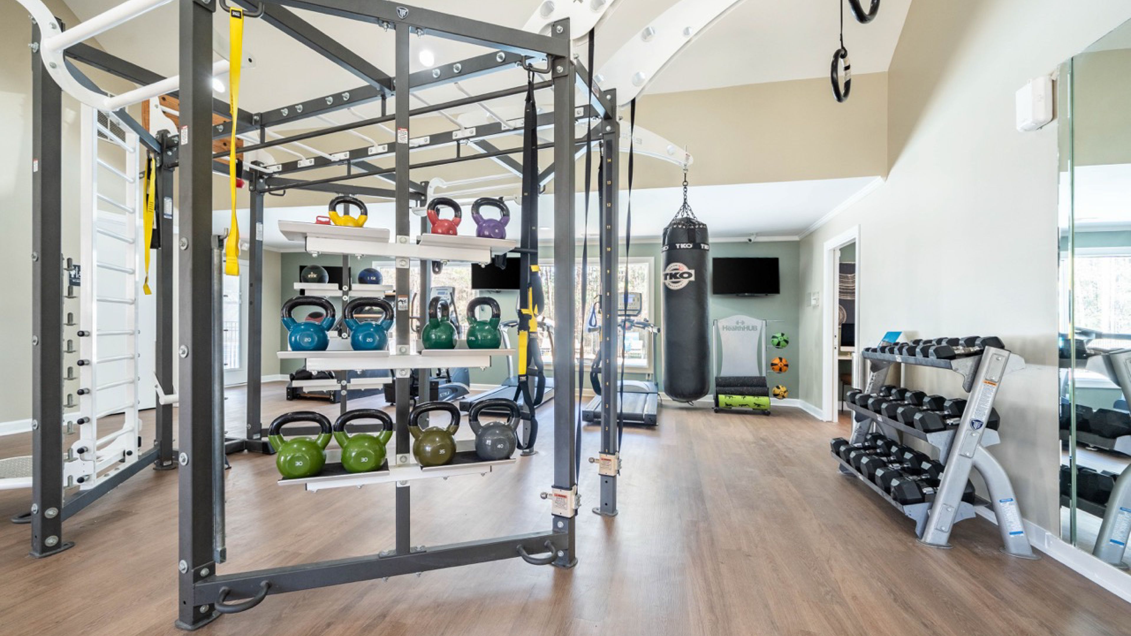 Hawthorne at Wisteria spacious apartment living room with ceiling fan, furnished with a couch, coffee table, and chair