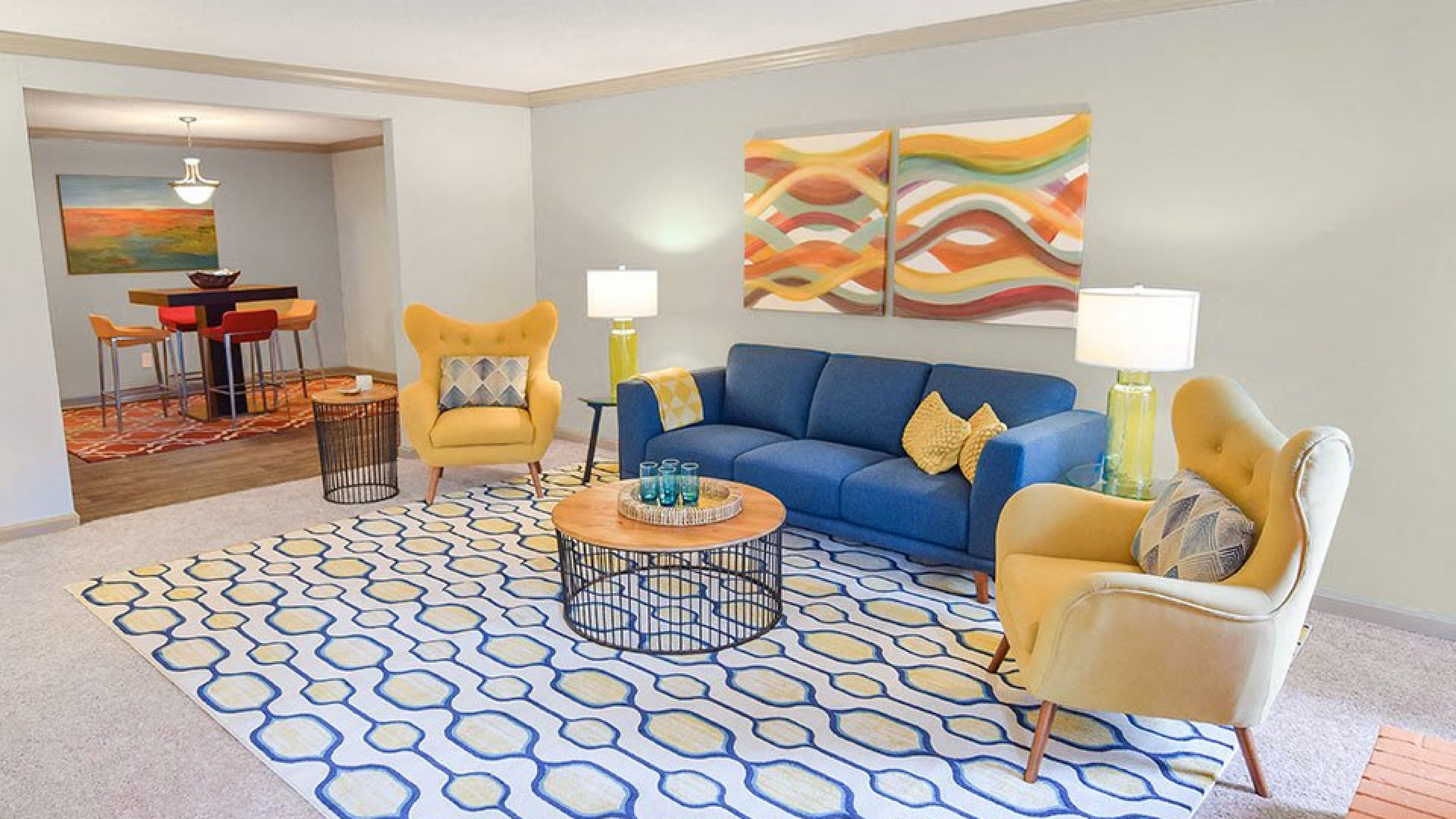 Hawthorne at Wisteria spacious apartment living room with ceiling fan, furnished with a couch, coffee table, and chair